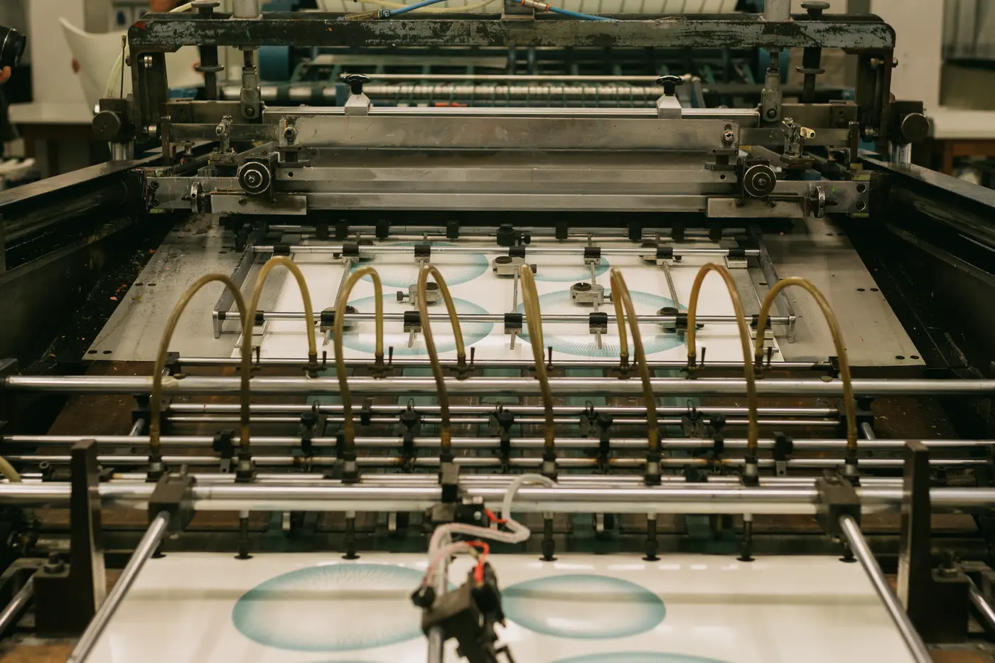 An industrial printing press running a job