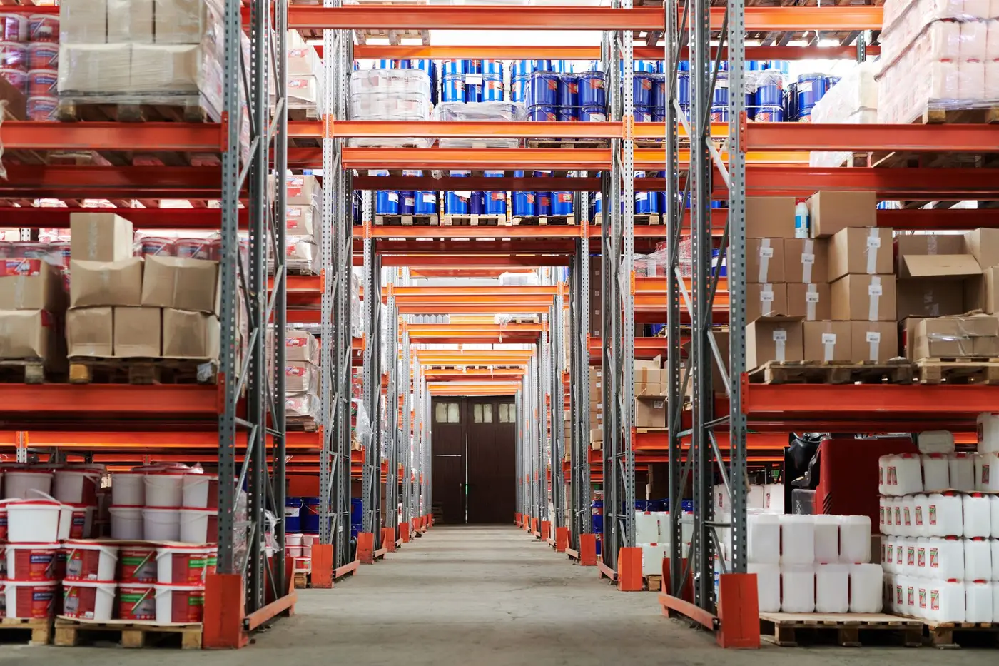 A warehouse aisle stacked with boxed inventory