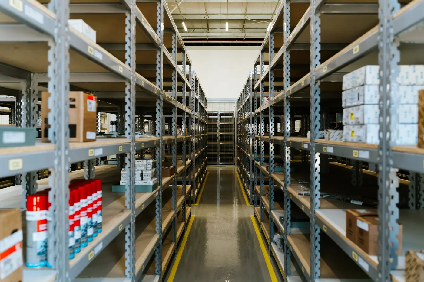 Rows of stocked warehouse shelving