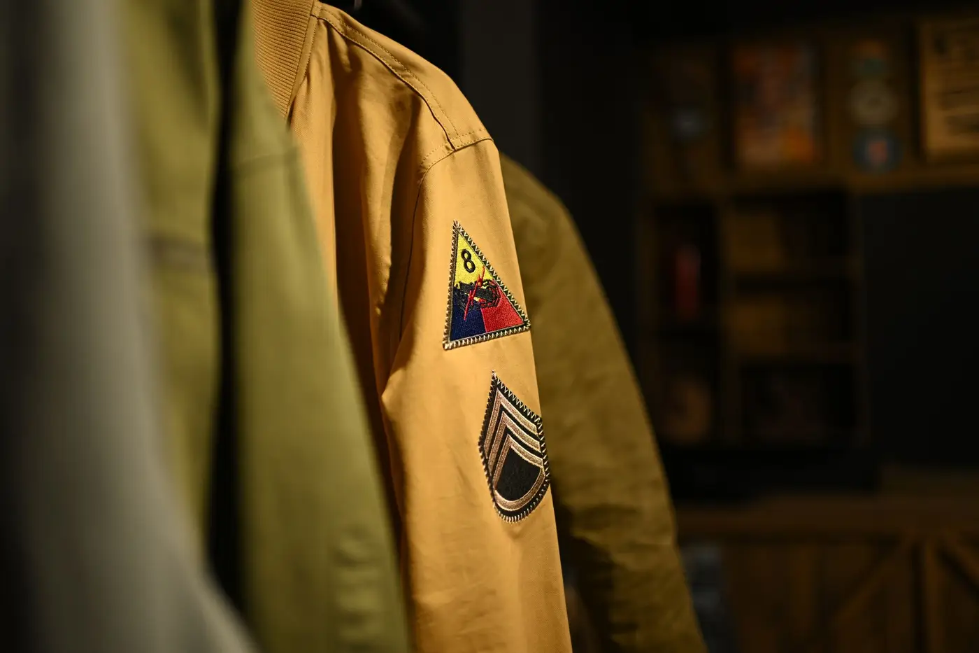 A jacket sleeve showing several stitched patches