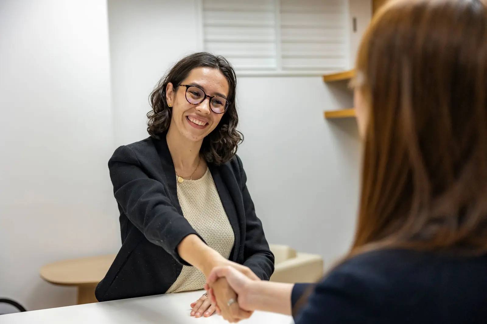 A manager congratulating an employee on their work anniversary