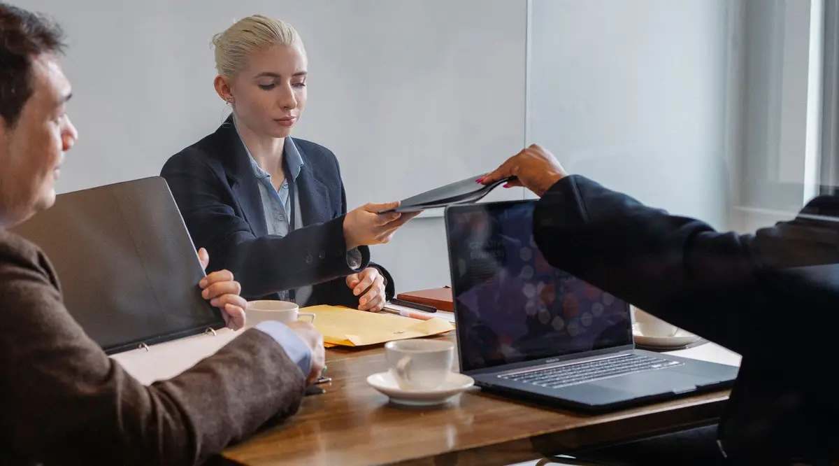 Colleagues reviewing a document together at an office table