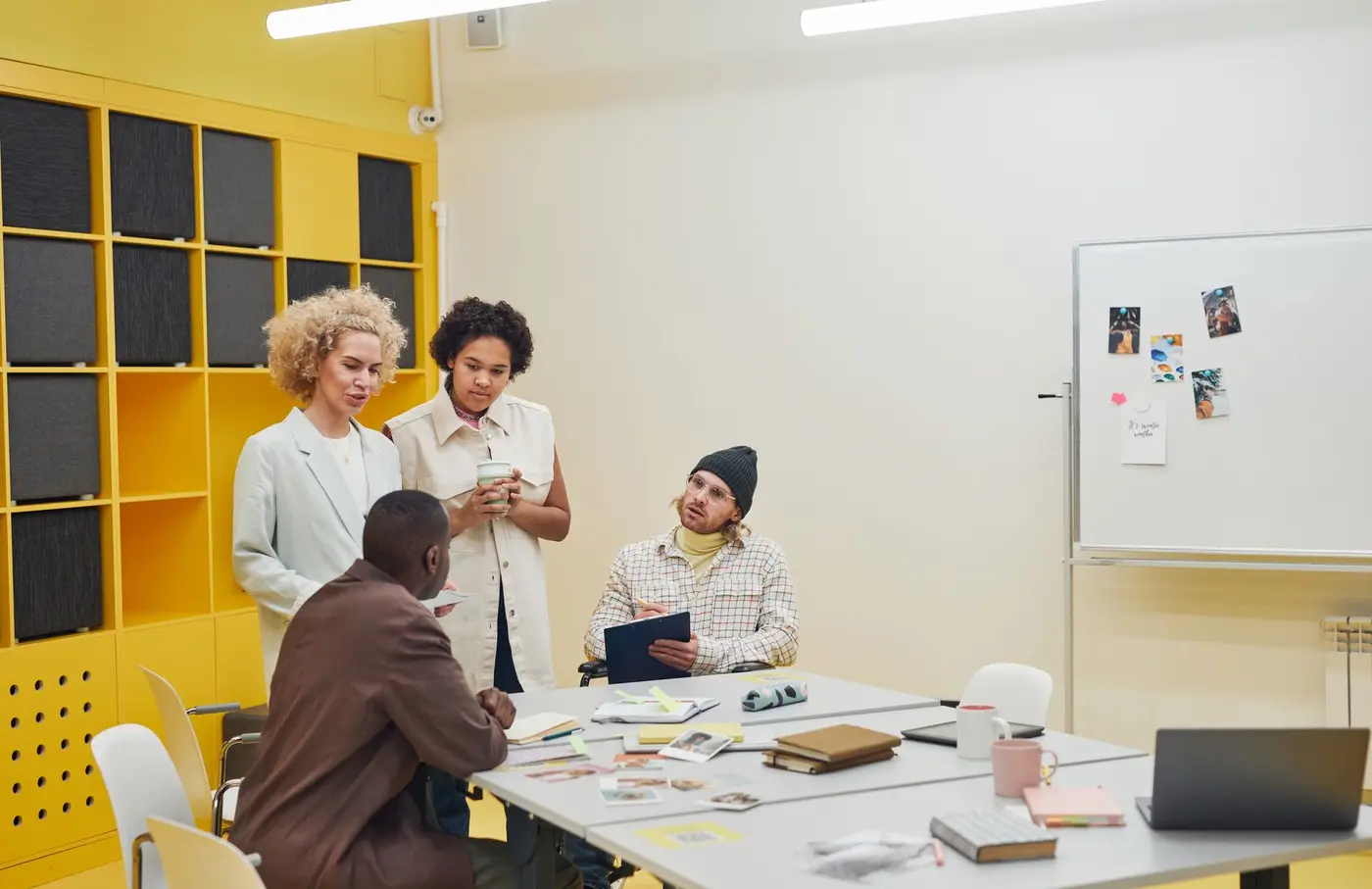 A team collaborating around a table in a bright meeting room