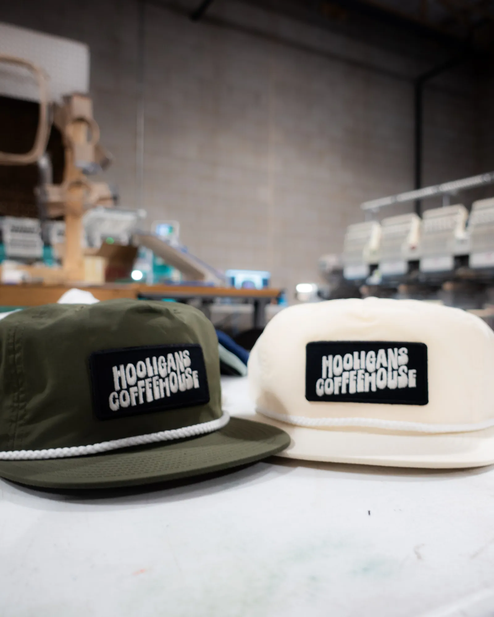 A custom cap with an embroidered logo alongside printed apparel