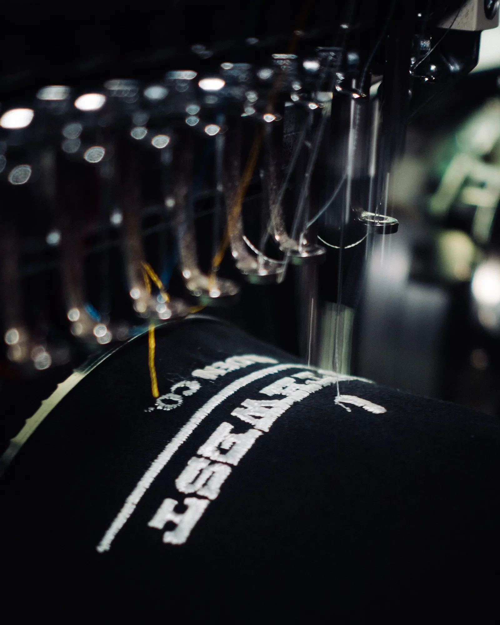 Close-up of dense embroidery stitches forming a logo
