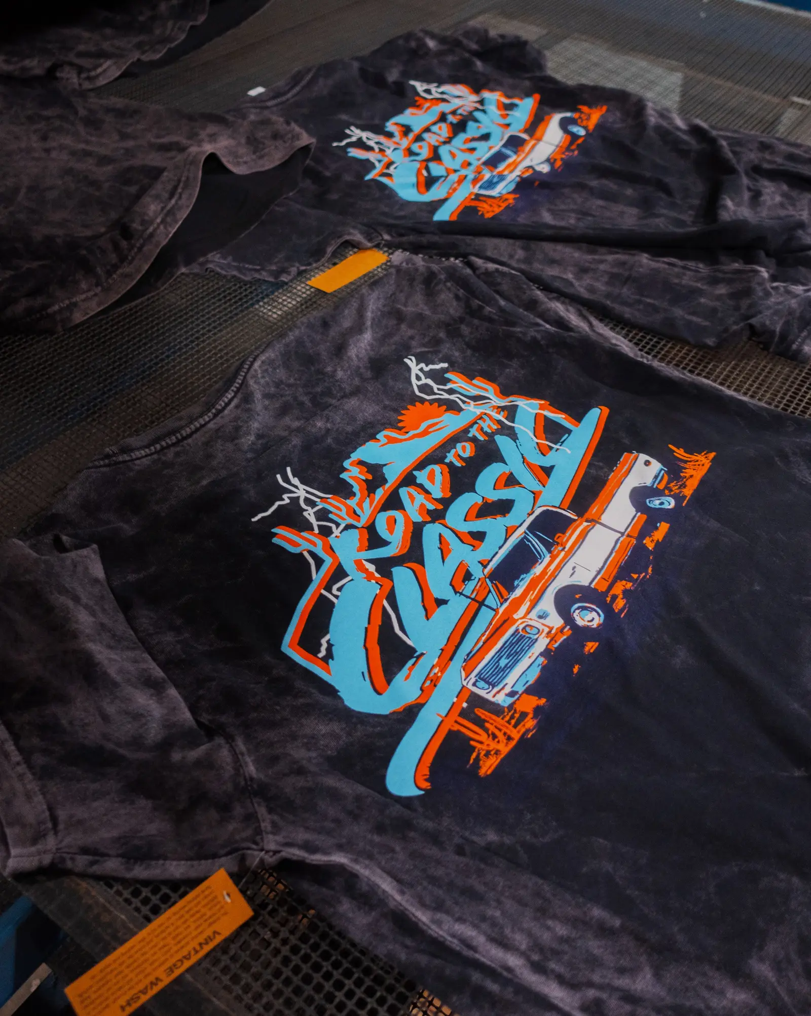 A finished custom screen-printed shirt with a bold vintage design